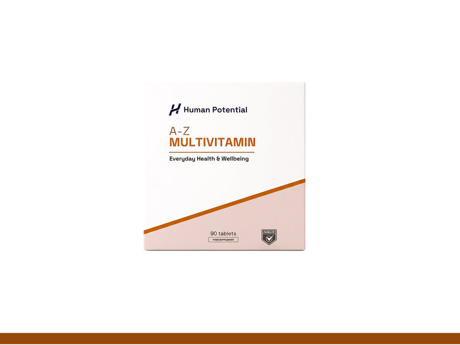 A box of Human Potential A-Z Multivitamin tablets, featuring a white and dusty pink design with a diagonal brown accent line, set against a clean white background.